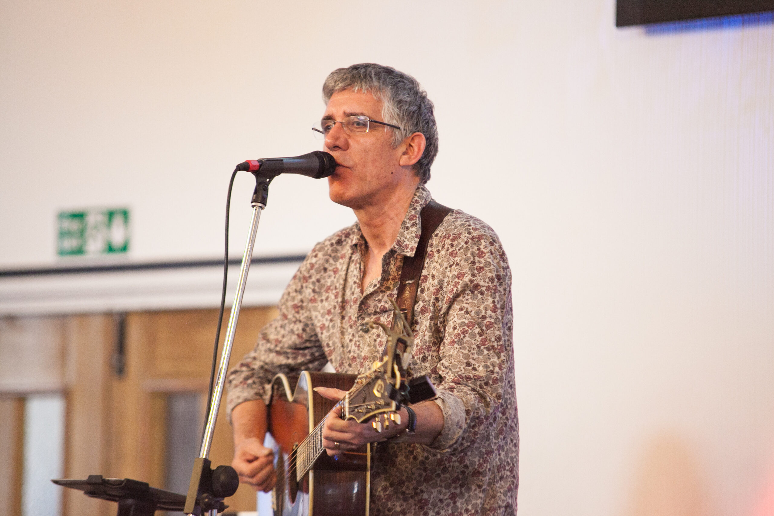 Image of Dave Bilbrough leading worship.